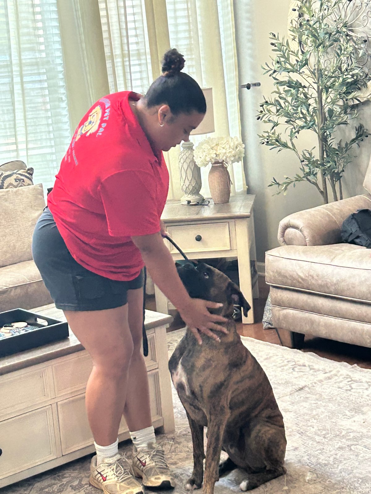 Alliyah working with a dog during a training session
